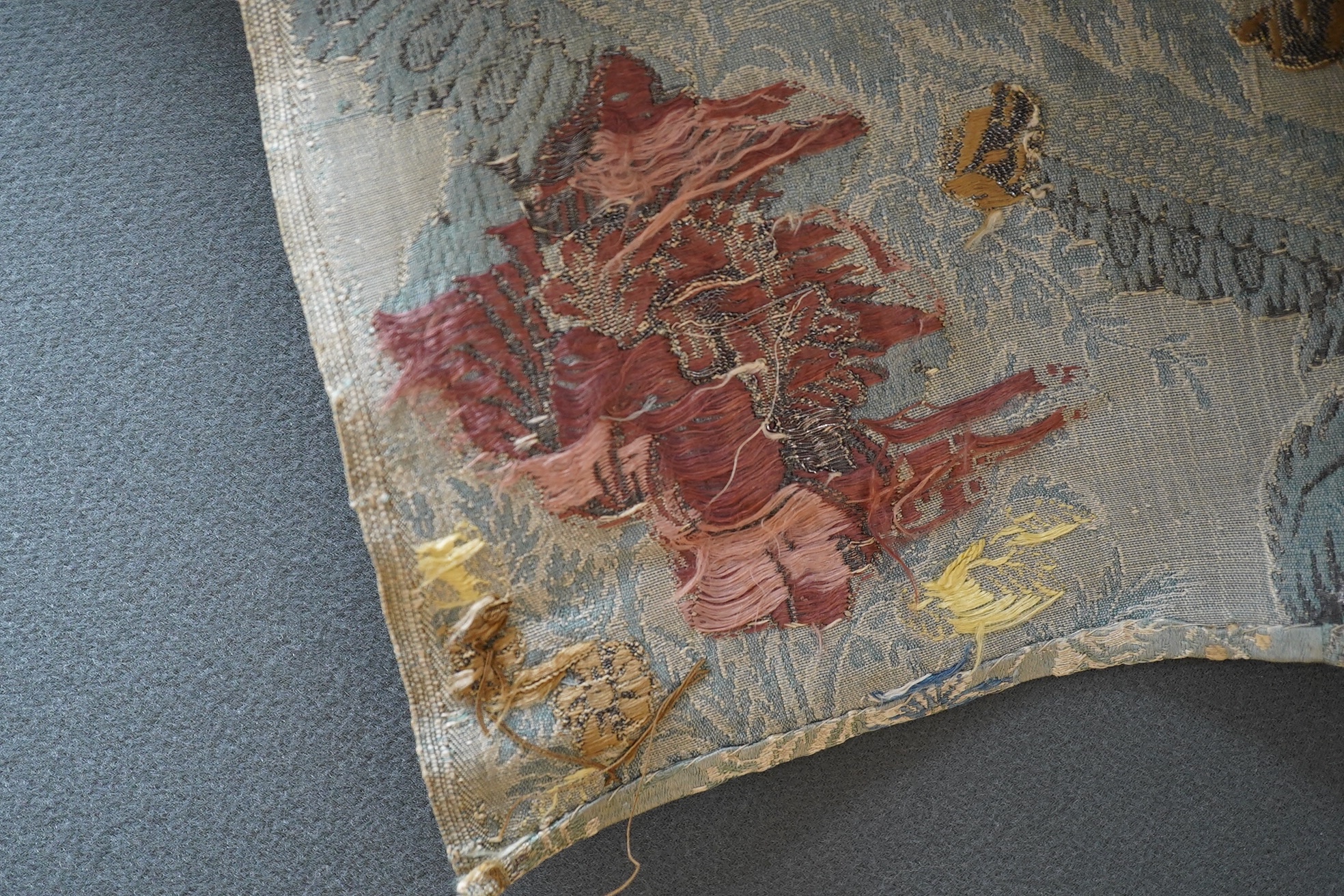 Samples of 18th century French, possibly Lyon silk, short loom brocades including two pairs and three single samples of varying sizes, one pair multi polychrome of large exotic flowers and fruits, the other pair pale blu